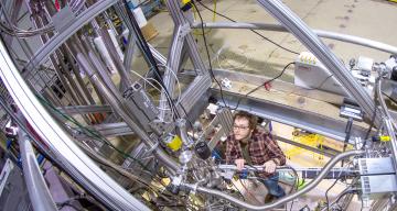 researcher tunes instruments in LZ detector