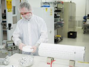 LZ researcher holding top of prototype detector
